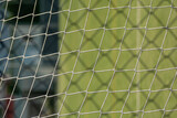 Football or Soccer net blend together with Metal fence net close up . Texture . Pattern. Background.