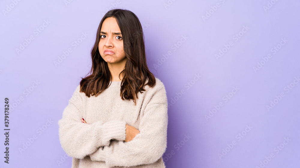 Young mixed race hispanic woman isolated suspicious, uncertain, examining you. Young mixed race hispanic woman isolated suspicious, uncertain, examining you.