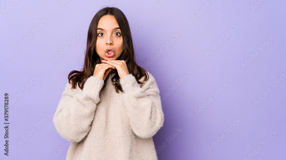 Young mixed race hispanic woman isolated praying for luck, amazed and opening mouth looking to front. Young mixed race hispanic woman isolated praying for luck, amazed and opening mouth looking to front.