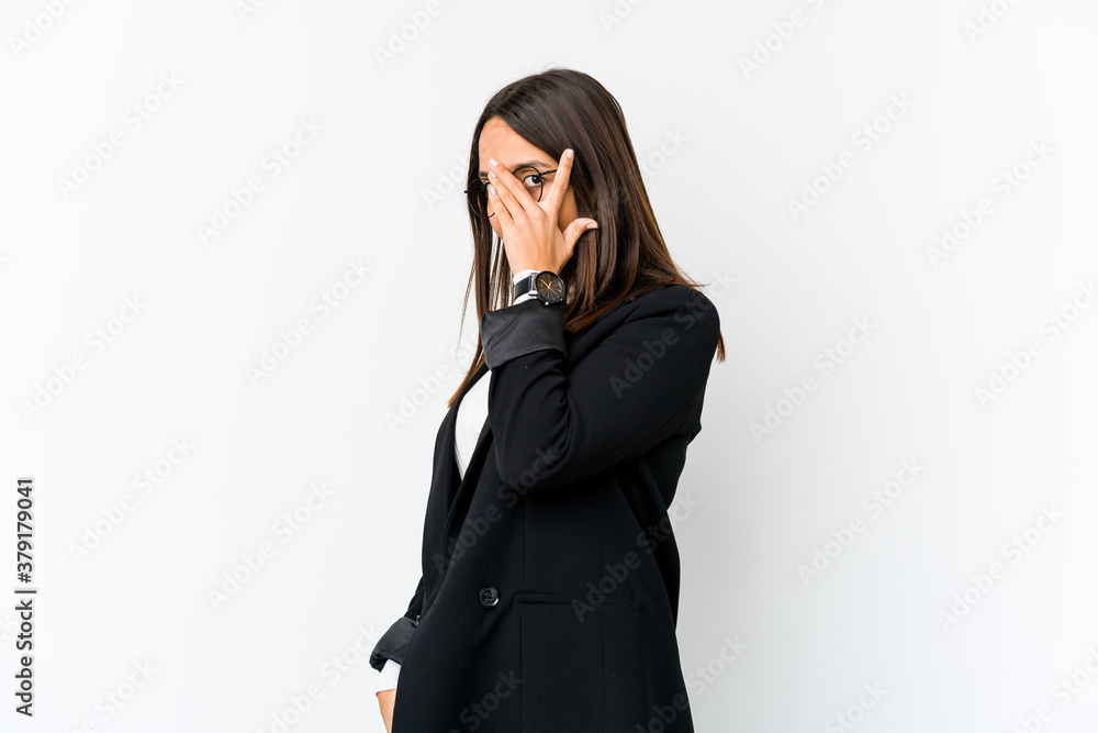 Young mixed race business woman isolated on white background blink through fingers frightened and nervous. Young mixed race business woman isolated on white background blink through fingers frightened and nervous.