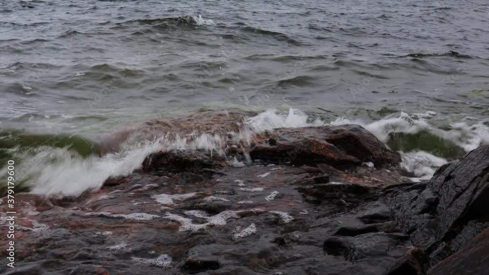 Waves from the sea hitting the rocks at shore on a cloudy and windy day in Sweden! Waves from the sea hitting the rocks at shore on a cloudy and windy day in Sweden!