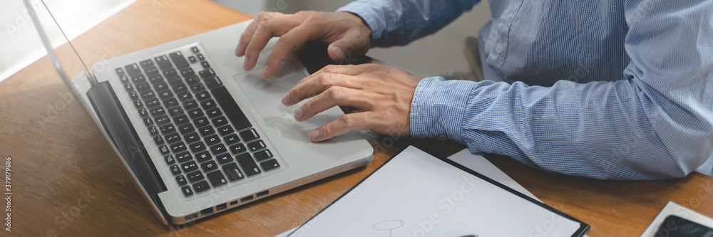 Business accountant working with laptop in office. Business accountant working with laptop in office.