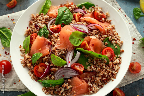 Buckwheat salad with smoked salmon, cherry tomato, red onion and greens