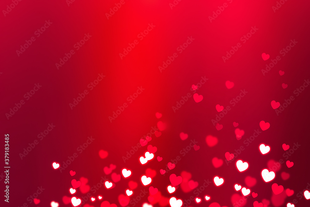 Glowing white hearts with bokeh effect