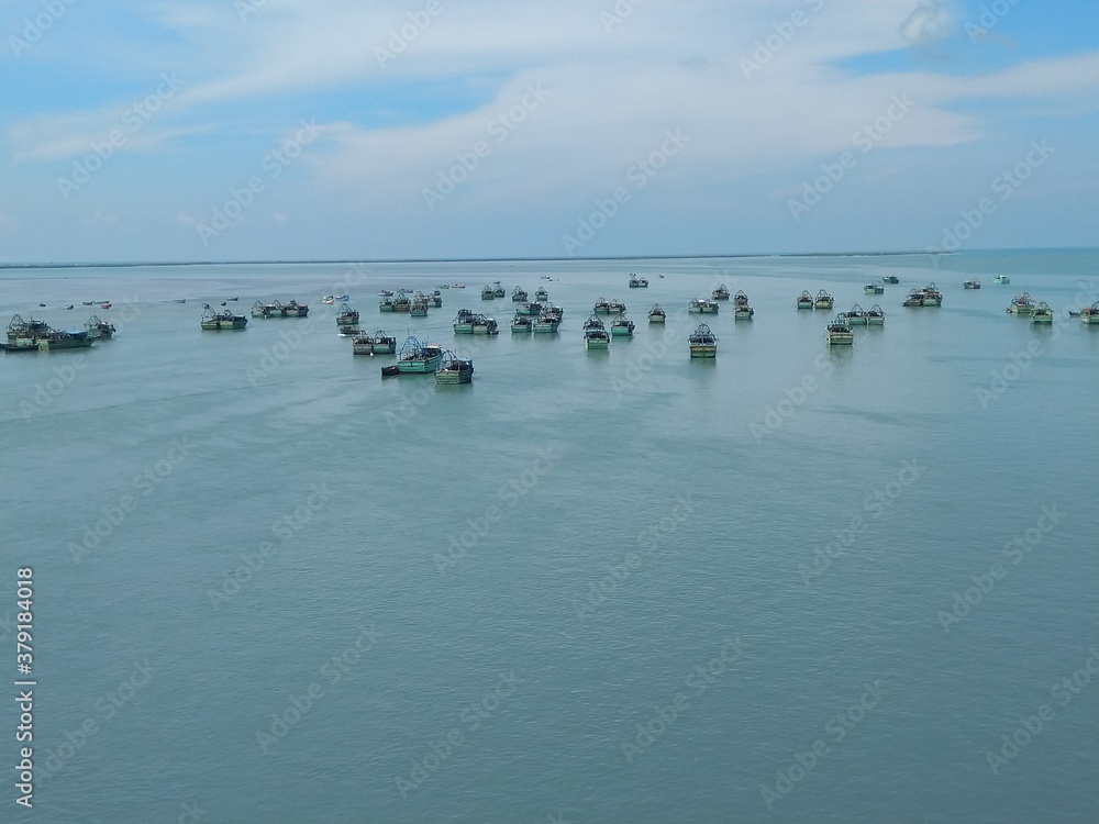 Naklejka premium Group of boats(flotilla) in the silent sea