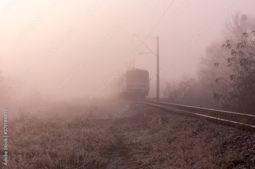 Riding train into fog. Train driving through the fog. Morning fog on the railway. Riding train into fog. Train driving through the fog. Morning fog on the railway.