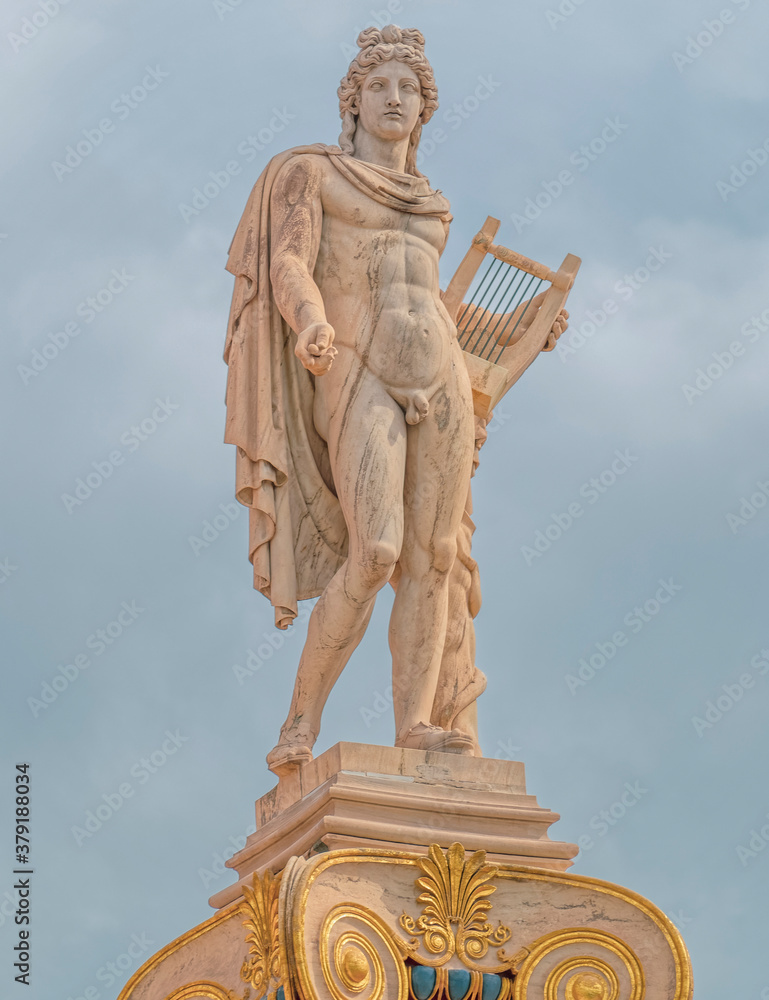 Apollo statue the ancient Greek god under cloudy sky