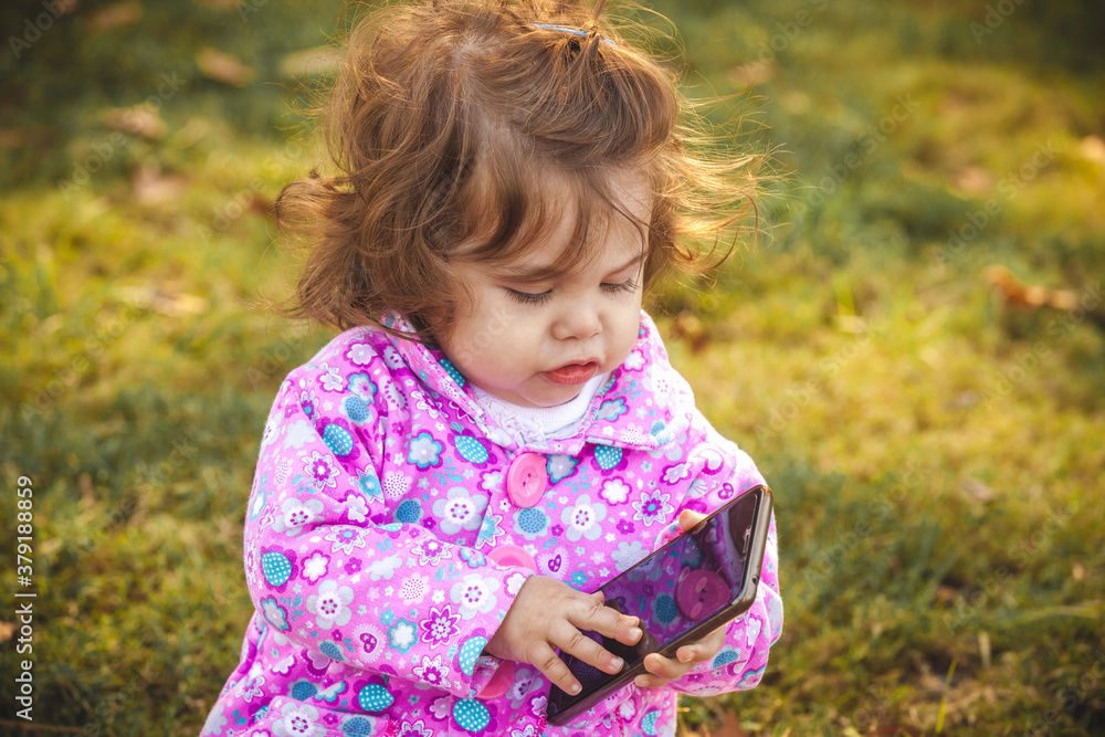 baby with mobile in park baby with mobile in park