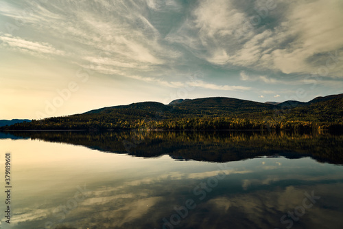 Dead still water at Krøderen. Norway's second largest lake. Calm weather in autumn. Shot in september.