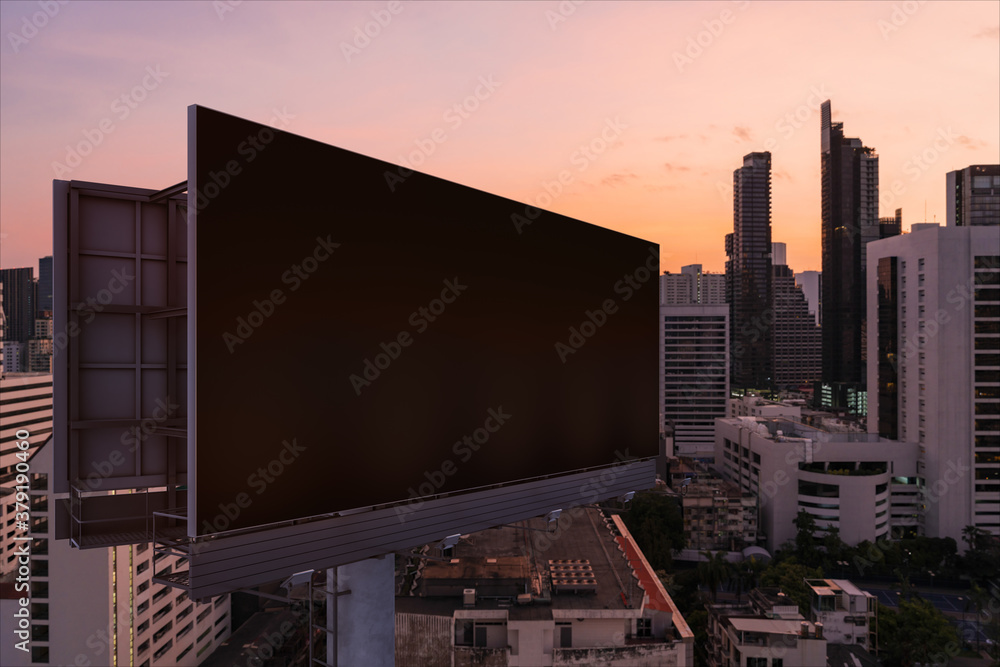Blank black road billboard with Bangkok cityscape background at night time. Street advertising poster, mock up, 3D rendering. Side view. The concept of marketing communication to promote idea. Blank black road billboard with Bangkok cityscape background at night time. Street advertising poster, mock up, 3D rendering. Side view. The concept of marketing communication to promote idea.