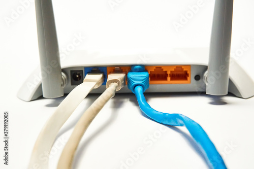 Network cable connects to wireless router  router  internet  global network.