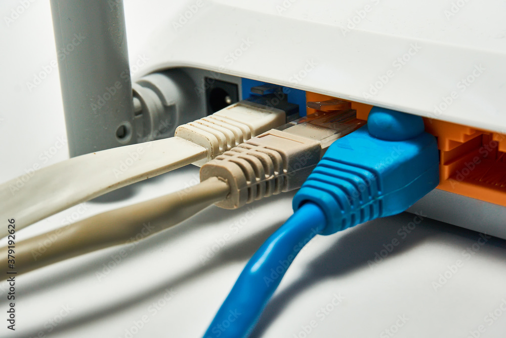 Connecting to a router, network cables connected to a router. Connecting to a router, network cables connected to a router.