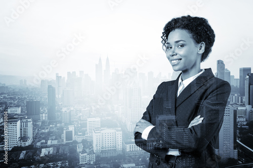 Photography Smiling black African American business woman in suit in crossed arms pose