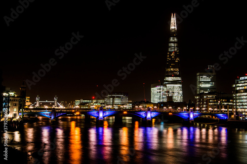 Thames river with building lights in the night