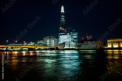 Thames river with building lights in the night