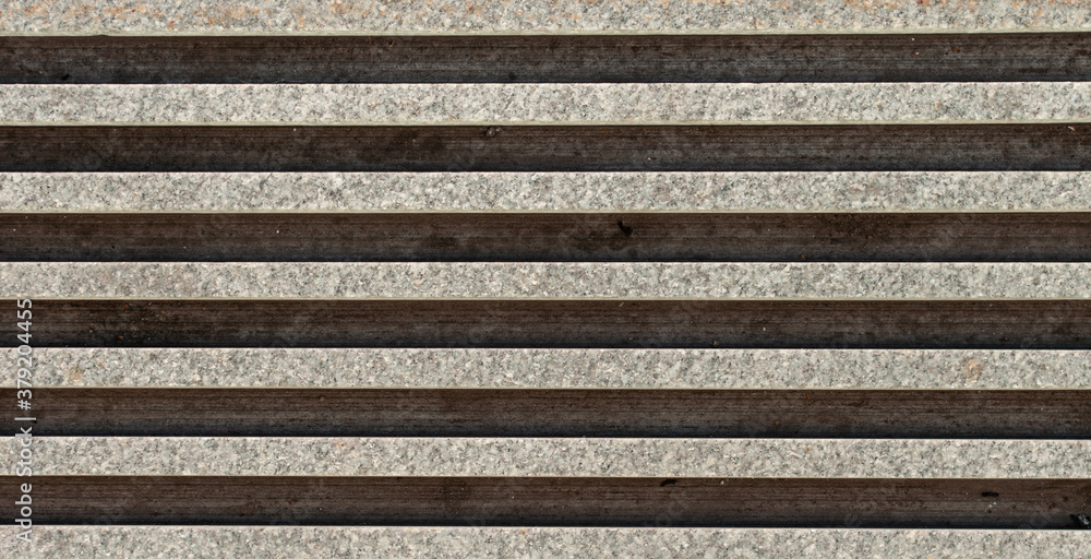 Concrete paver block with parallel slots