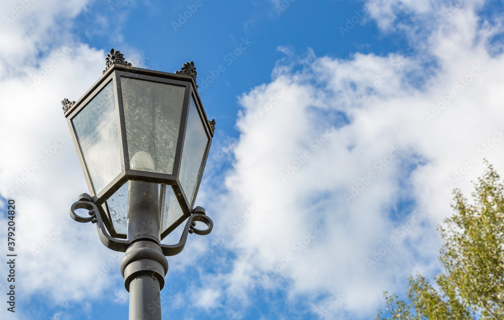 Vintage black iron lantern in a public park