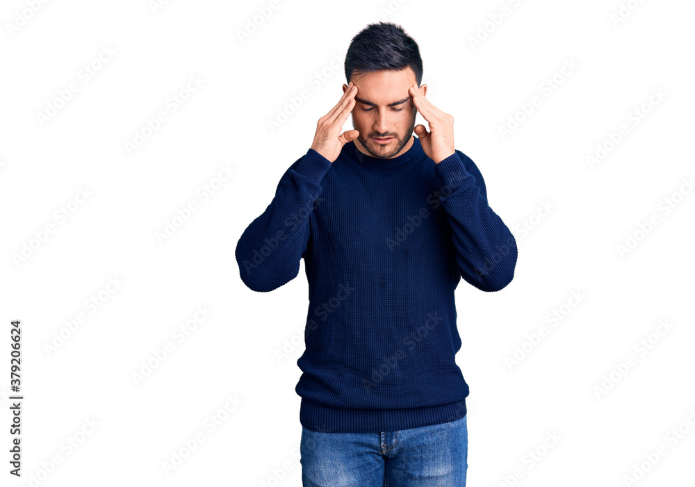 Fototapeta premium Young handsome man wearing casual clothes with hand on head for pain in head because stress. suffering migraine.
