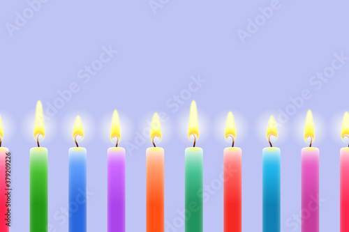 Many burning colored candles, seamless decorative border