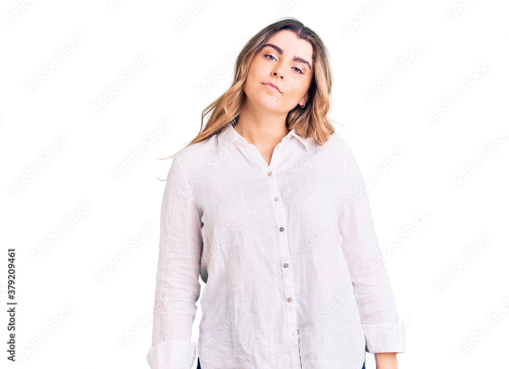 Young caucasian woman wearing casual clothes relaxed with serious expression on face. simple and natural looking at the camera. Young caucasian woman wearing casual clothes relaxed with serious expression on face. simple and natural looking at the camera.