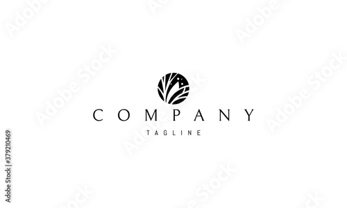 Vector black logo on which an abstract image of jungle thickets in a circle.
