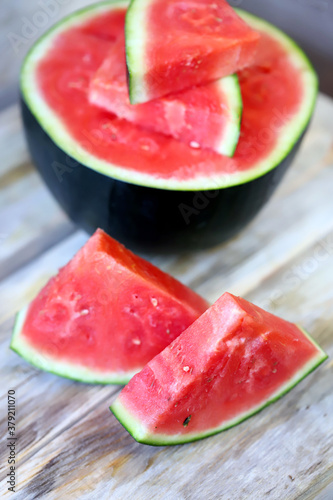 Melon and watermelon slices on a wooden surface. Selective focus. Macro.