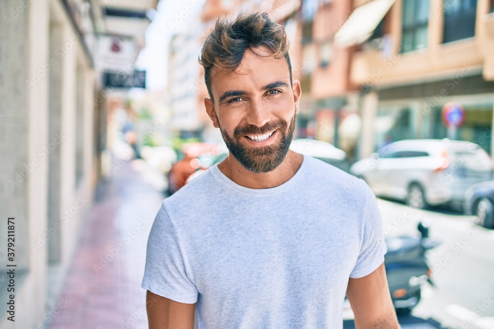 Young hispanic man smiling happy walking at the city Young hispanic man smiling happy walking at the city