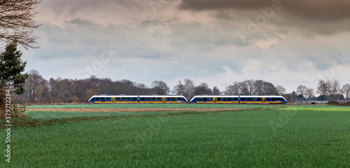 Train traveling through countryside in Lower Rhine Region