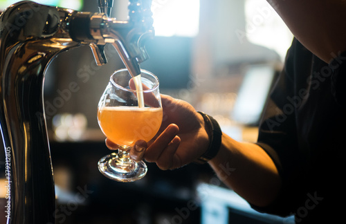 Vászonkép Beer Being Poured from the Tap in a Bar