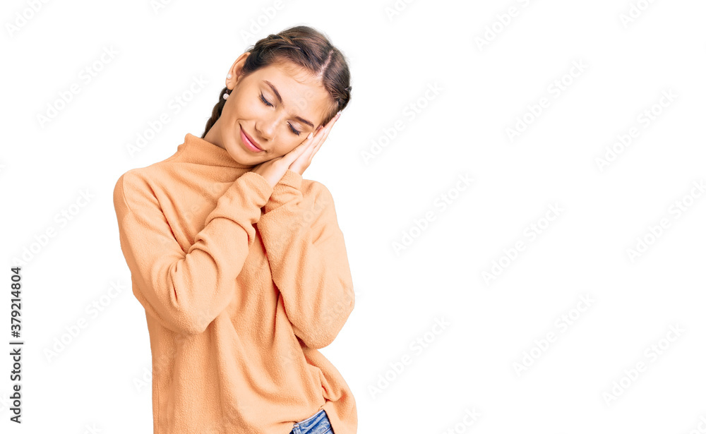 Beautiful caucasian woman with blonde hair wearing casual winter sweater sleeping tired dreaming and posing with hands together while smiling with closed eyes. Beautiful caucasian woman with blonde hair wearing casual winter sweater sleeping tired dreaming and posing with hands together while smiling with closed eyes.