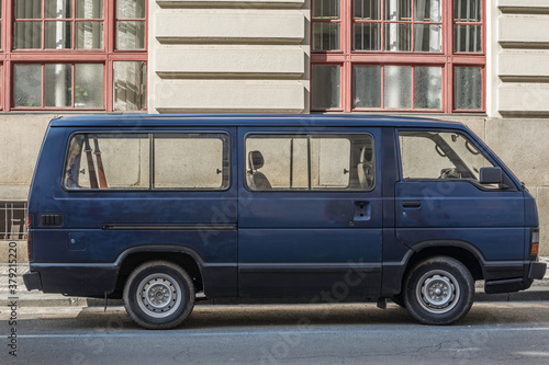 Praga, Republica Checa; August 6, 2018: Old blue van parked in the street of the city.  photo