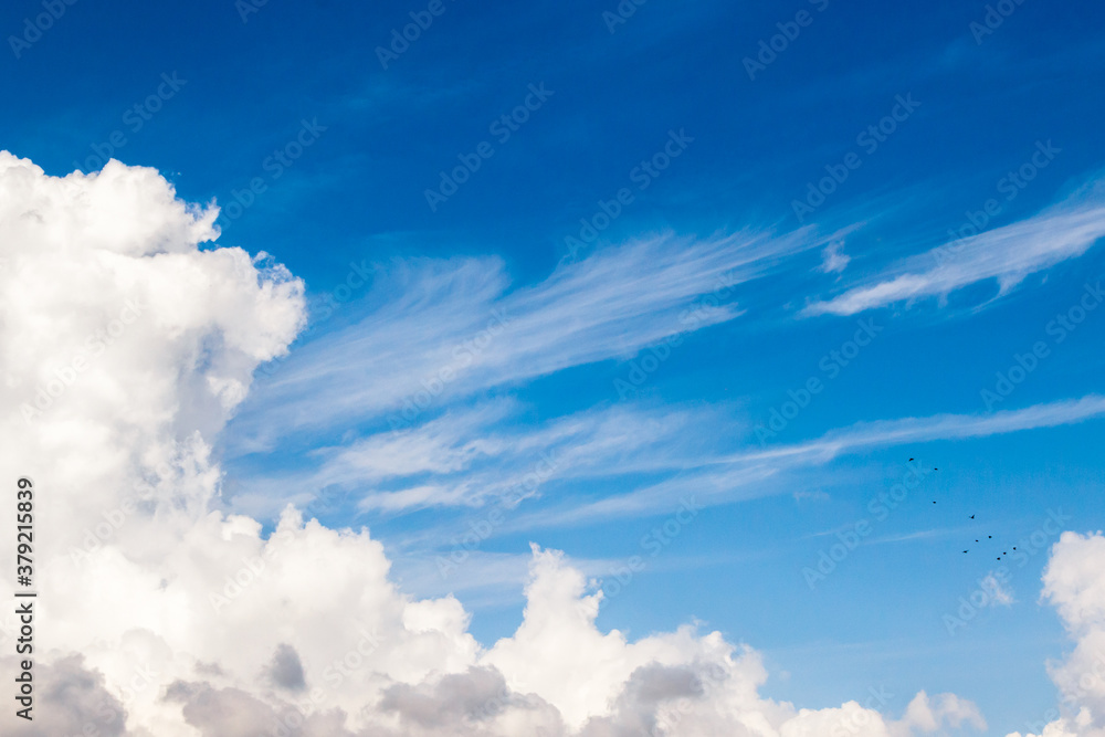 cumulus and high-cumulus clouds of an average tier on blue heavenly space cumulus and high-cumulus clouds of an average tier on blue heavenly space