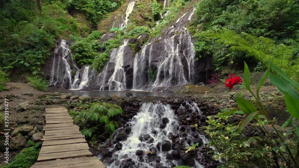 Waterfall Pucak Manik hidden in tropical rainforest jungle island Bali, Indonesia. 4K Waterfall Pucak Manik hidden in tropical rainforest jungle island Bali, Indonesia. 4K