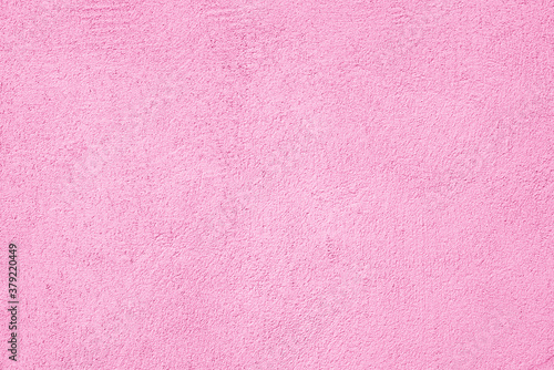 Abstract pink stucco texture background. Plastered building wall.