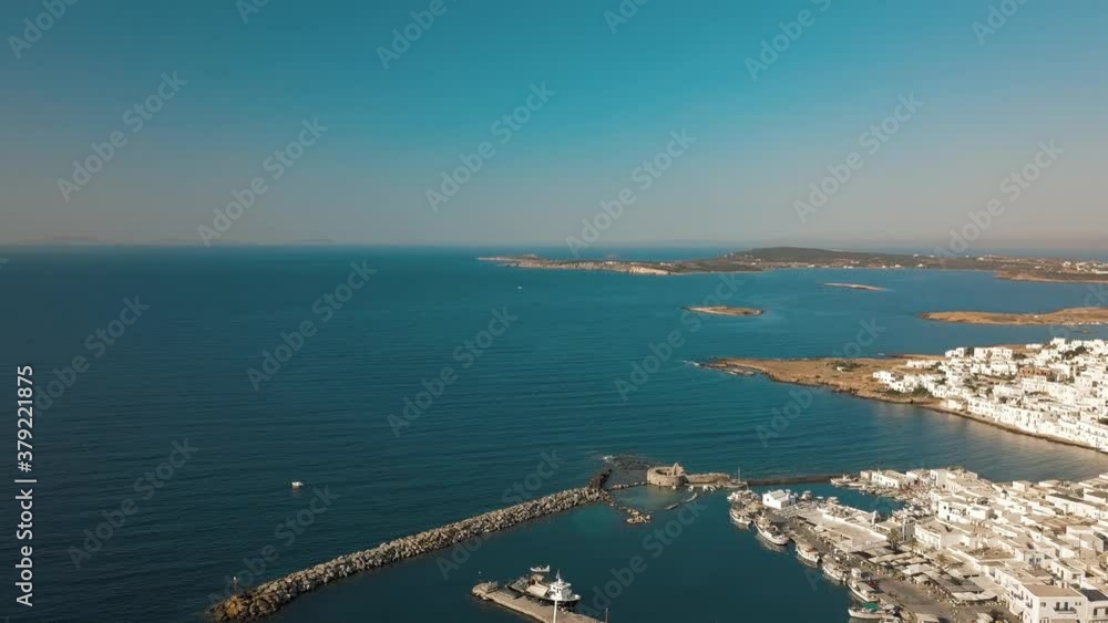 Aerial view of the pier with Paros island on a background Naousa village Aerial view of the pier with Paros island on a background Naousa village