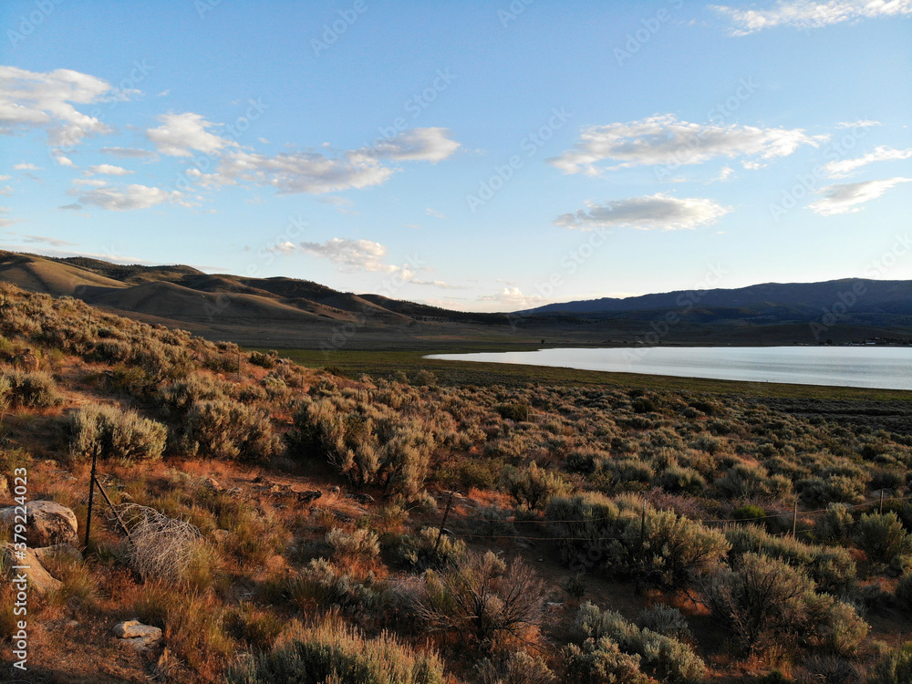 Lake and desert view with beautiful blue sky and clouds Lake and desert view with beautiful blue sky and clouds