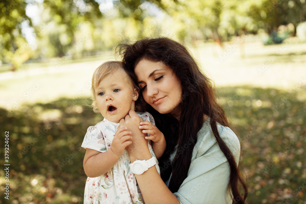 Portrait of amazing mother with cute little daughter walking in the forest. Family concept. Portrait of amazing mother with cute little daughter walking in the forest. Family concept.