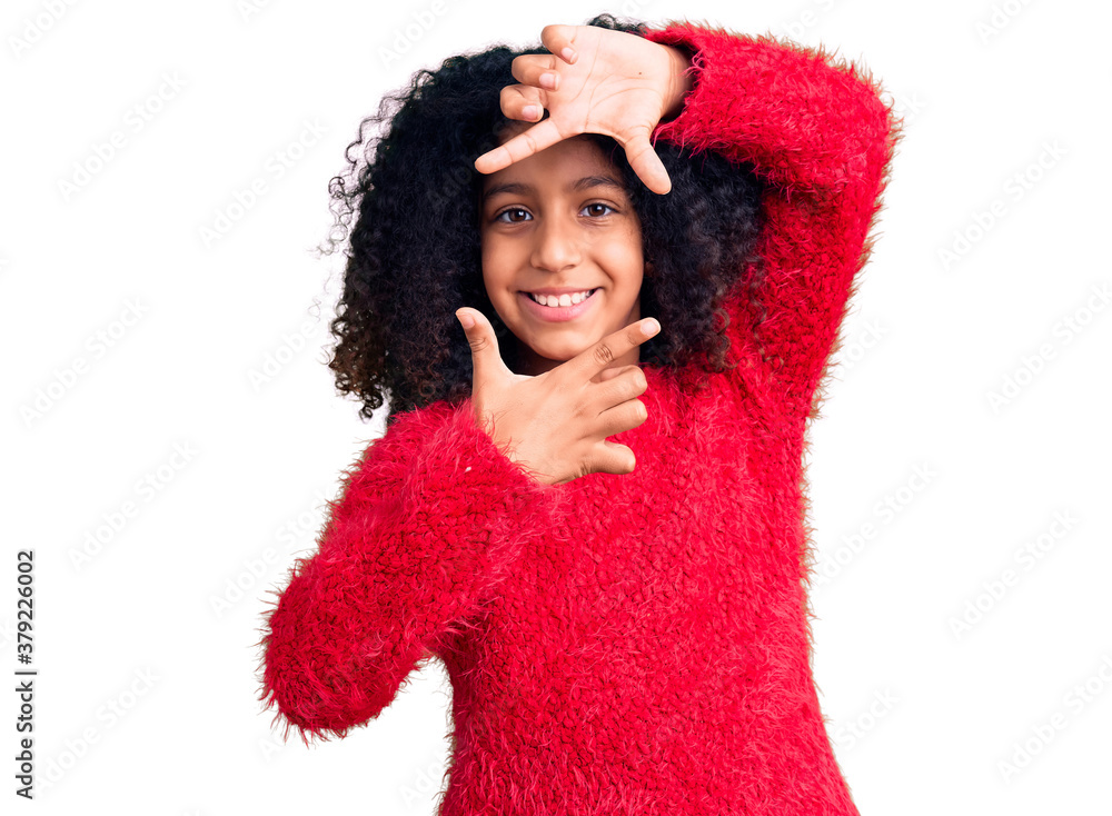 African american child with curly hair wearing casual winter sweater smiling making frame with hands and fingers with happy face. creativity and photography concept. African american child with curly hair wearing casual winter sweater smiling making frame with hands and fingers with happy face. creativity and photography concept.