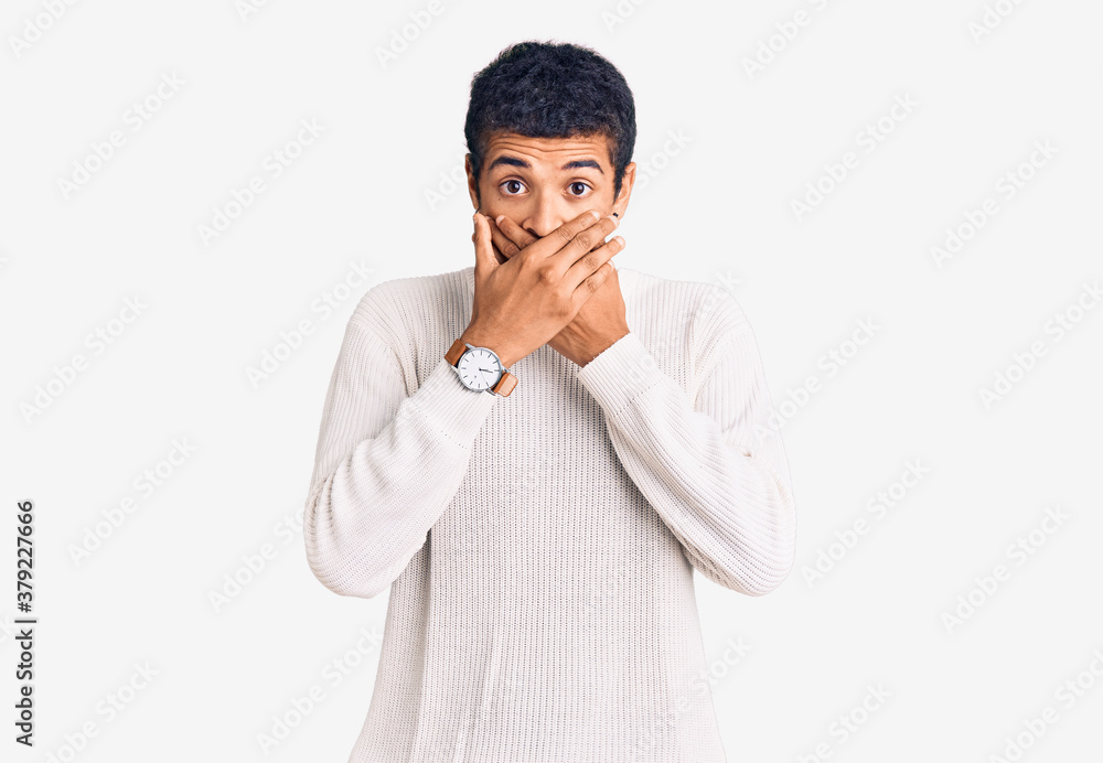 Young african amercian man wearing casual clothes shocked covering mouth with hands for mistake. secret concept. Young african amercian man wearing casual clothes shocked covering mouth with hands for mistake. secret concept.