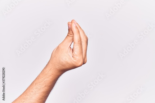 Canvas Print Close up of hand of young caucasian man over isolated background doing italian g