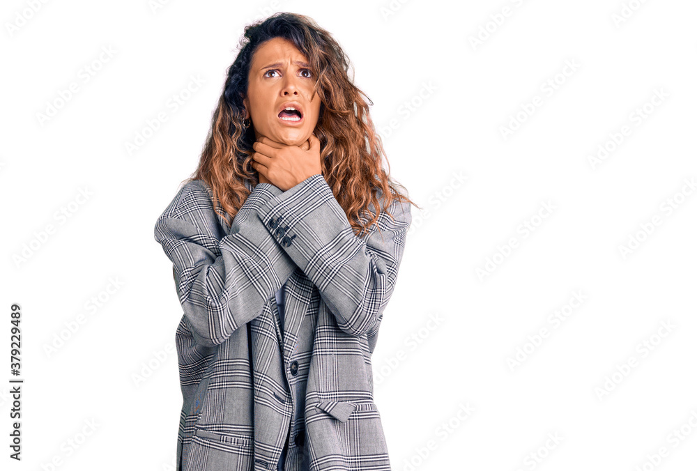 Young hispanic woman with tattoo wearing business oversize jacket shouting and suffocate because painful strangle. health problem. asphyxiate and suicide concept. Young hispanic woman with tattoo wearing business oversize jacket shouting and suffocate because painful strangle. health problem. asphyxiate and suicide concept.