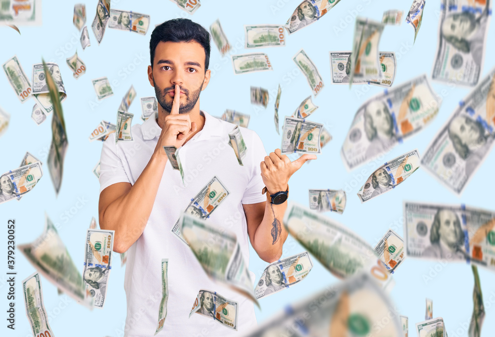 Obraz premium Young handsome hispanic man wearing casual clothes asking to be quiet with finger on lips pointing with hand to the side. silence and secret concept.