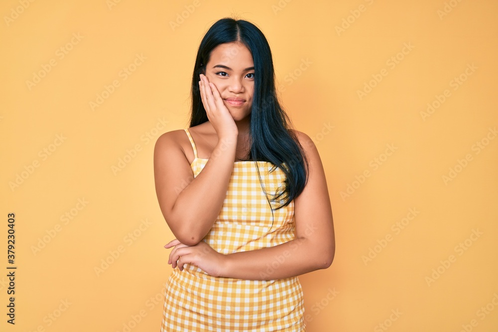 Young beautiful asian girl wearing casual clothes thinking looking tired and bored with depression problems with crossed arms. Young beautiful asian girl wearing casual clothes thinking looking tired and bored with depression problems with crossed arms.