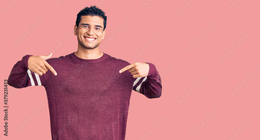Hispanic handsome young man wearing casual clothes looking confident with smile on face, pointing oneself with fingers proud and happy. Hispanic handsome young man wearing casual clothes looking confident with smile on face, pointing oneself with fingers proud and happy.