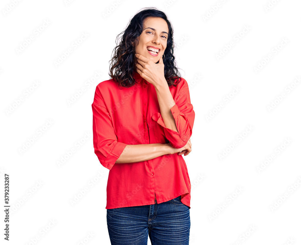 Young beautiful hispanic woman wearing casual clothes looking confident at the camera smiling with crossed arms and hand raised on chin. thinking positive. Young beautiful hispanic woman wearing casual clothes looking confident at the camera smiling with crossed arms and hand raised on chin. thinking positive.