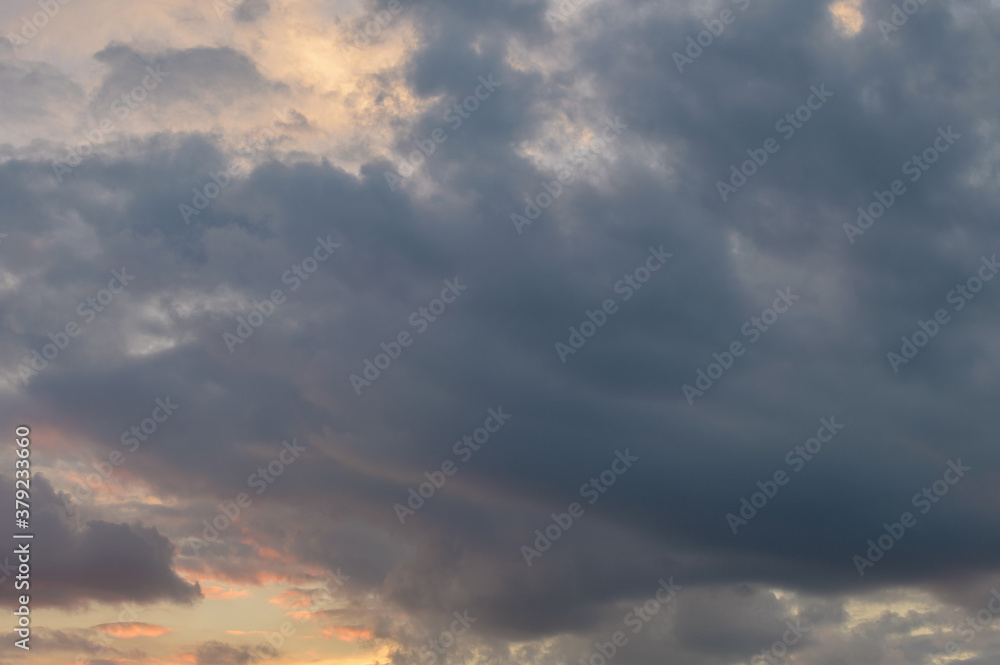 Abstract background of cloudy sunset sky golden hour.