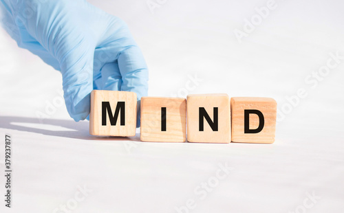 Wooden blocks with the word Mind. Medical concept.