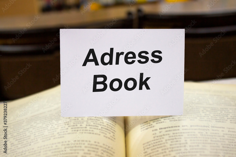Adress Book written in white note on open books Adress Book written in white note on open books
