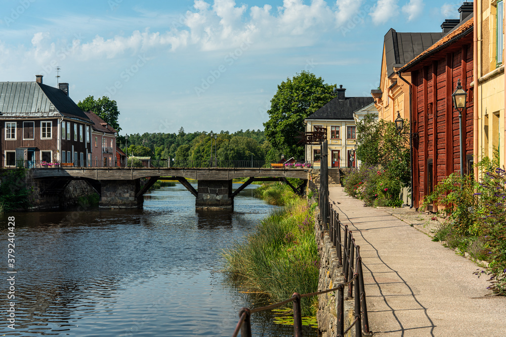Beautiful summer view of a walking path by the river in a small town in Sweden called Arboga Beautiful summer view of a walking path by the river in a small town in Sweden called Arboga