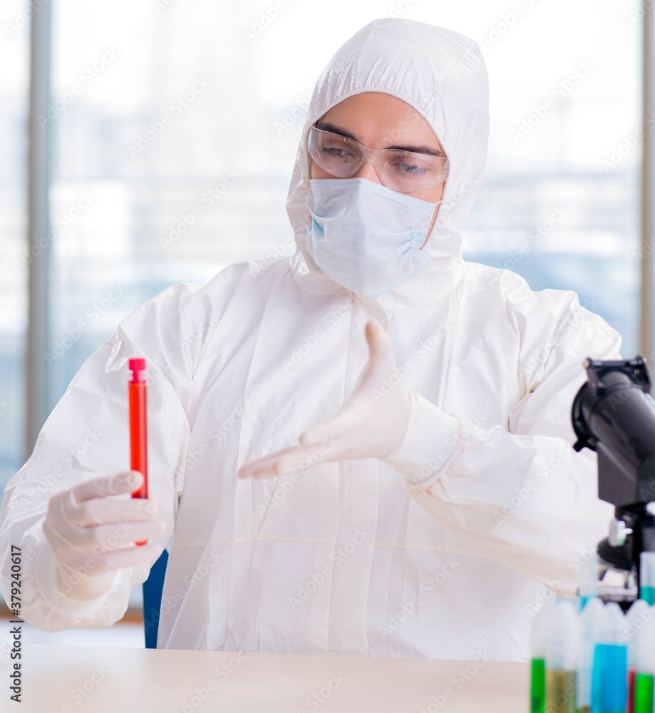 Man doctor checking blood samples in lab Man doctor checking blood samples in lab